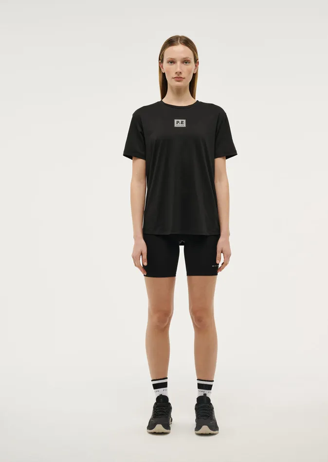 Baseline PE Nation Women CROSSOVER TEE IN BLACK