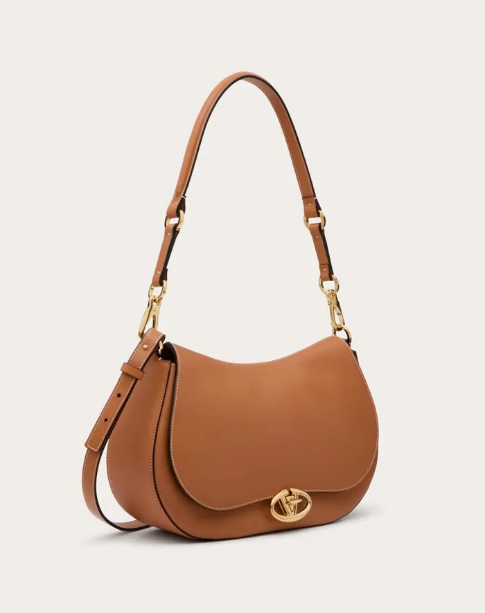 Valentino Shoulder Bags Woman Valentino Garavani Ohval Medium Shoulder Bag In Nappa Calfskin For Woman In Almond Almond Valentino Shoulder Bags Woman Valentino Garavani Ohval Medium Shoulder Bag In Nappa Calfskin For Woman In Almond Almond