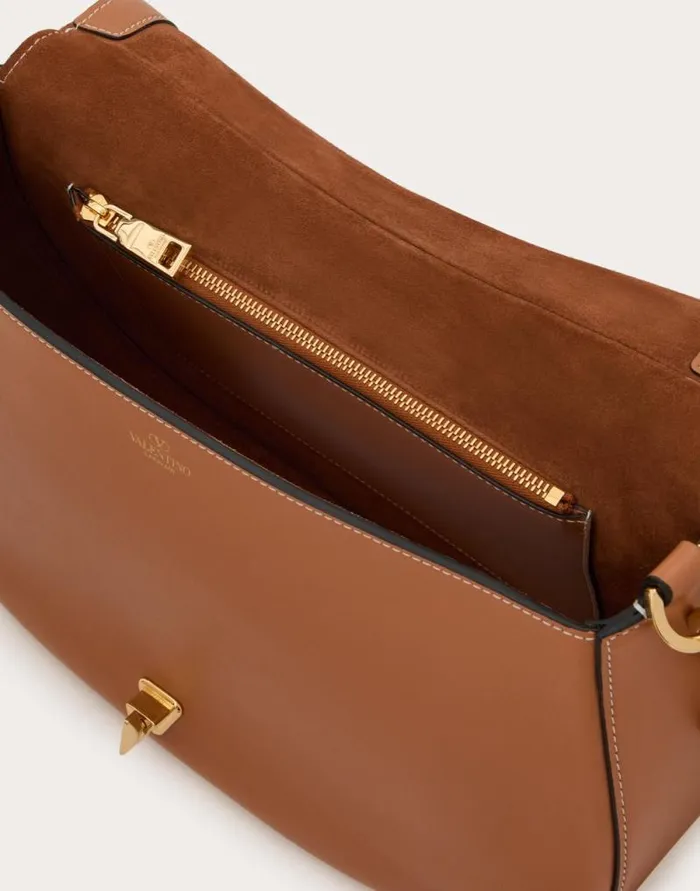 Valentino Shoulder Bags Woman Valentino Garavani Ohval Medium Shoulder Bag In Nappa Calfskin For Woman In Almond Almond Valentino Shoulder Bags Woman Valentino Garavani Ohval Medium Shoulder Bag In Nappa Calfskin For Woman In Almond Almond