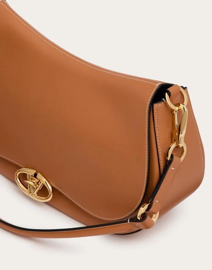 Valentino Shoulder Bags Woman Valentino Garavani Ohval Medium Shoulder Bag In Nappa Calfskin For Woman In Almond Almond Valentino Shoulder Bags Woman Valentino Garavani Ohval Medium Shoulder Bag In Nappa Calfskin For Woman In Almond Almond